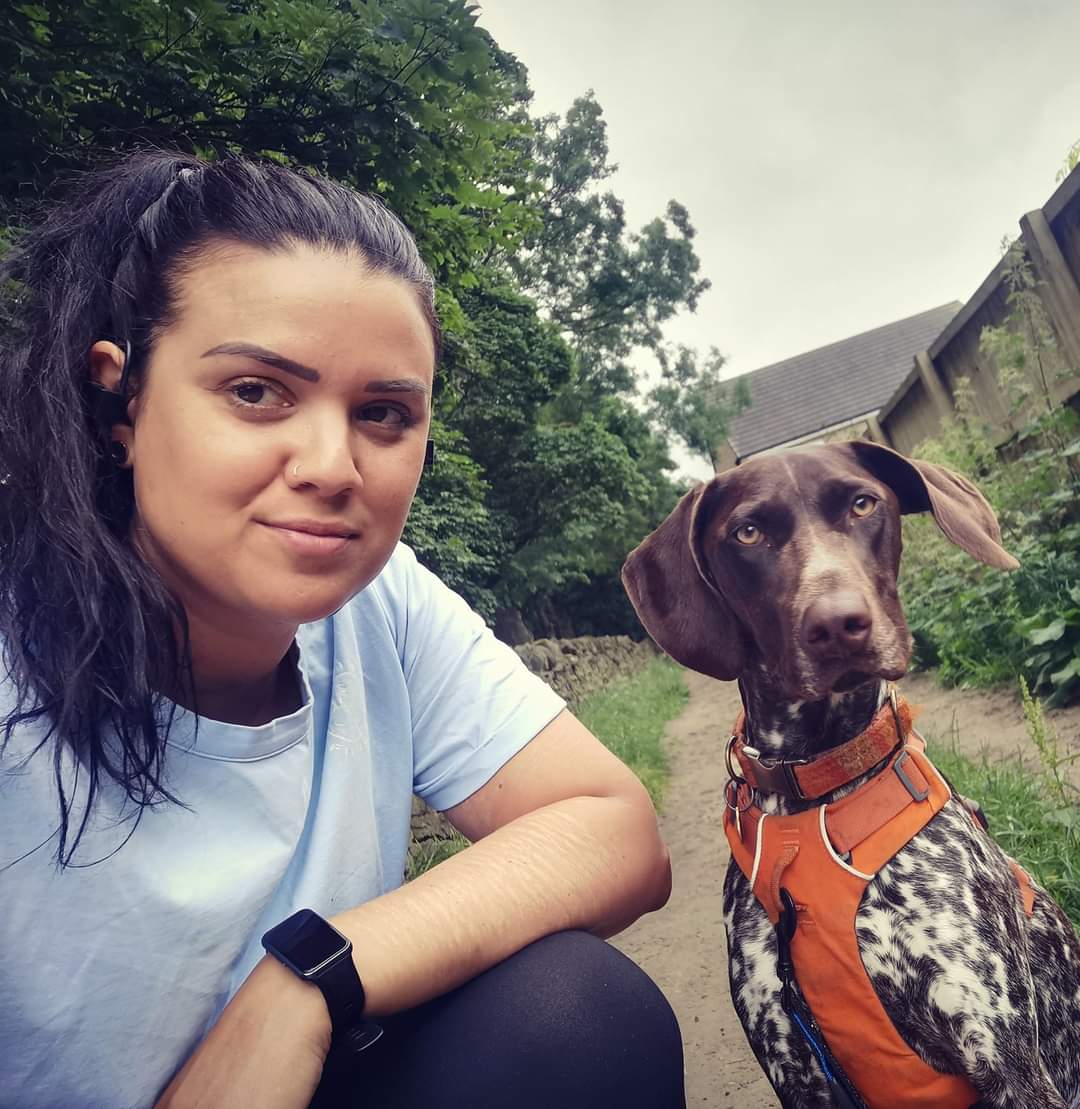 Laura and Juno on a trail, ready for a run together