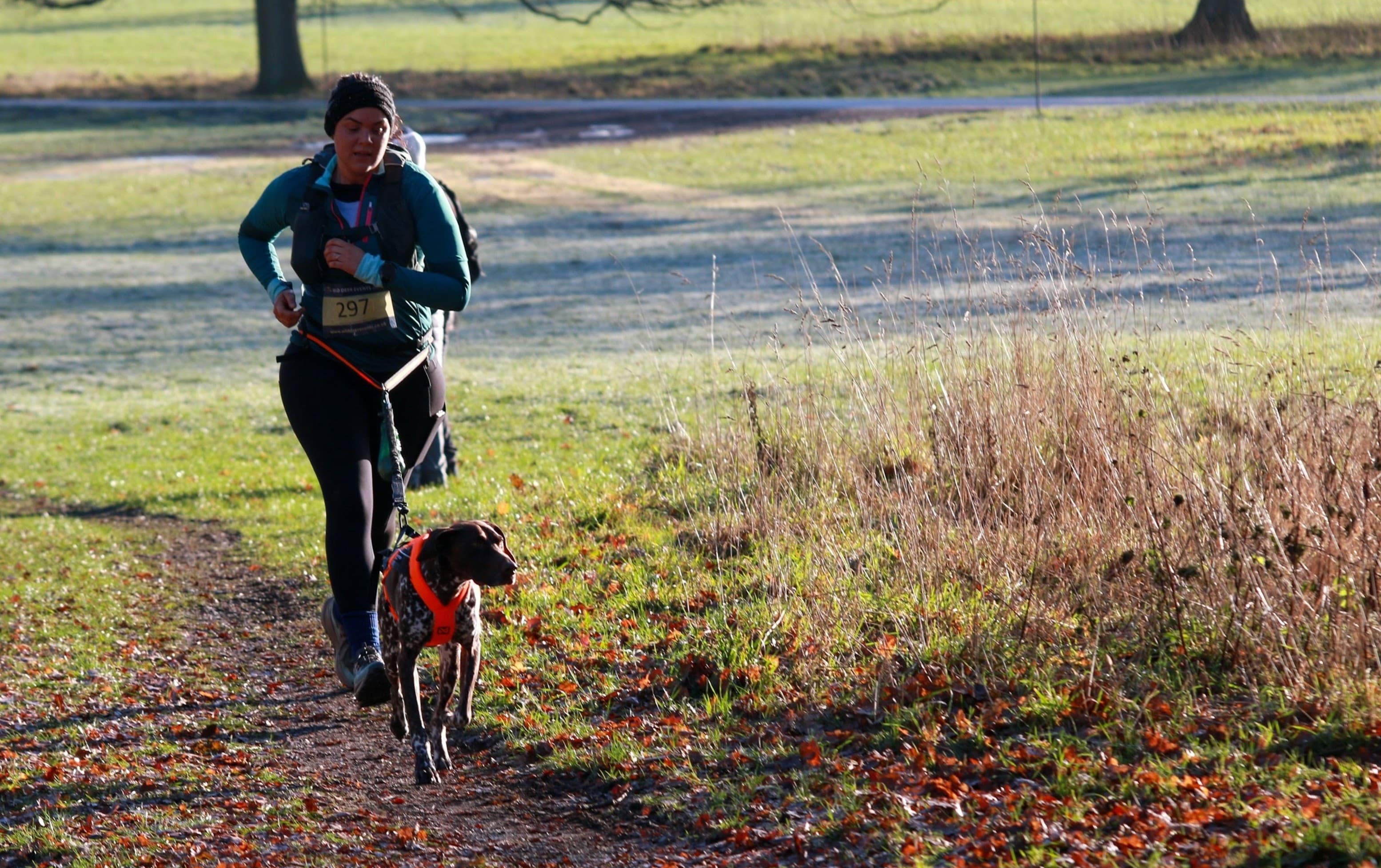 Laura and Juno taking part in a canicross event